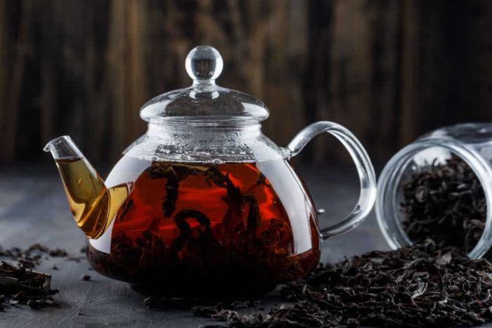 black-tea-with-dry-tea-teapot-wooden-surface-side-view-min